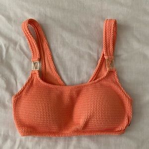Victoria’s Secret orange bikini top, size XS.